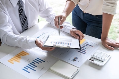 group of business leader team conference on meeting presentation to planning investment project working and strategy of business making conversation with partner, financial and accounting concept.