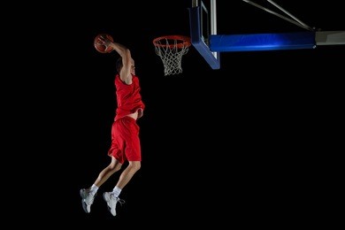 basketball game sport player in action isolated on black background