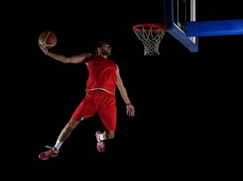 basketball game sport player in action isolated on black background