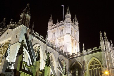the historic bath abbey at night.