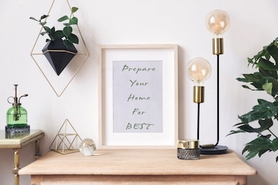 the retro mock up photo frame on the vintage wooden shelf , hanging plant in design pot, green sprinkler gold pyramid, plants and accessories. concept of minimalistic shelfie. home decor. template.