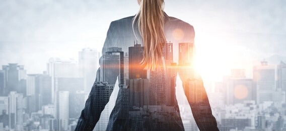 double exposure image of business person on modern city background. future business and communication technology concept. surreal futuristic cityscape and abstract multiple exposure graphic interface.