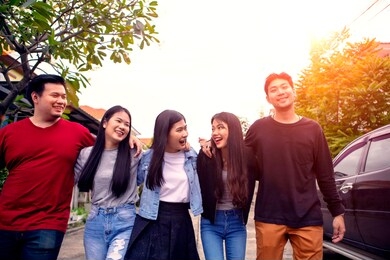 group of asian younger man and woman relaxing toothy smiling face with happiness emotion 