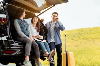 happy asian group of friends with car travel driving and suitcase at mountain road and street in vacation summer road trip on holidays to destination, traveler transportation vehicle people lifestyle 