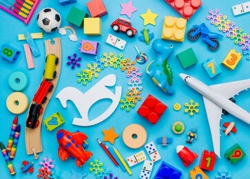 set of kids toys on blue background. top view, flat lay. 