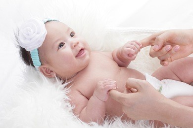 new born sleeping and smiling asian baby with white background