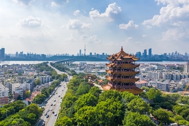 aerial view of  wuhan city .panoramic skyline and buildings beside yangtze river.4 chinese letters on tower is "nang xiong gao gong" means "amazing heaven"