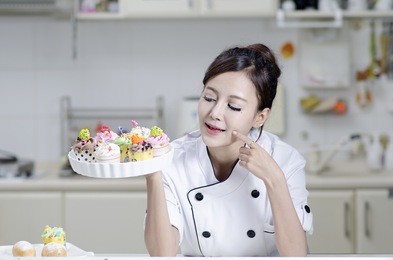 asian female chef in chef whites uniform