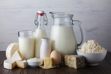 dairy products on wooden table still life