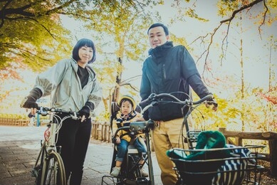 happy and playful japanese family in a park in tokyo