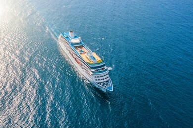 cruise ship liner sails in the sea leaving a plume on the surface of the water seascape. aerial view the concept of sea travel, cruises