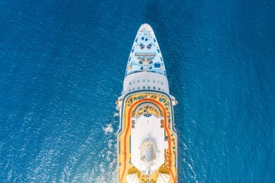 close up aerial top view nose of the cruise ship in the turquoise sea. concept of summer sea cruise tours