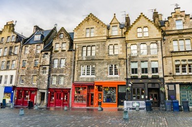 historic town houses and colourful shopfronts in edinburgh old town