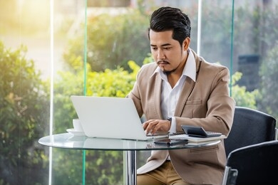 young business man using laptop computer