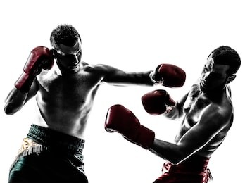 two caucasian  men exercising thai boxing in silhouette studio  on white background
