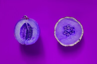 slices cantaloupe sliced isolated on purple neon background.flat lay. concept ideas food