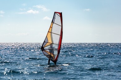 beautiful view of windsurfer sailing on the waves. windsurfing on the black sea. yalta, crimea.