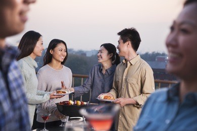 friends drinking on rooftop