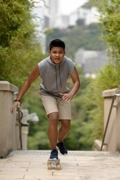 teenager skateboarding. young asian man skateboarding. 