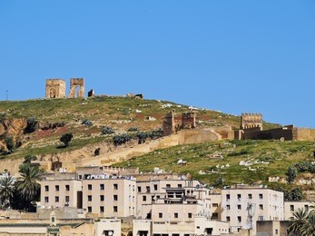 ruins of merinid tombs on the hill above old medina in fes, morocco, africa