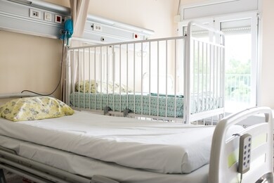 empty patient beds in a children's hospital room or maternity ward 