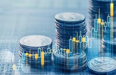 business growth or financial concept. double exposure of candlestick and stack of coins over bank account passbook background (depth of field photography).