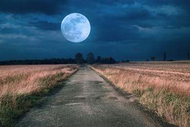 moonrise over asphalt road