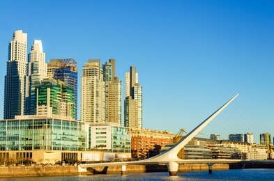 skyscraper and the women's bridge in the upscale neighborhood of puerto madero in buenos aires