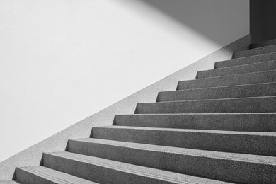 architectural design of stair concrete with shadow looking at a mirage black and white. copy space