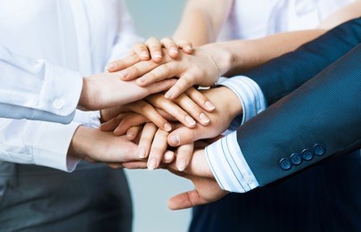 concept of teamwork. business people joined hands