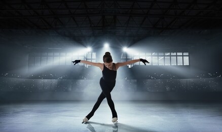 figure skating girl in ice arena.