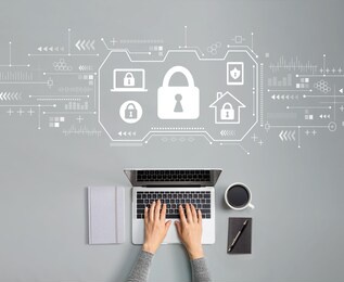 security theme with person using a laptop