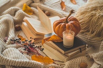 still life details in home interior. autumn decor. read, rest. cozy autumn or winter concept.
