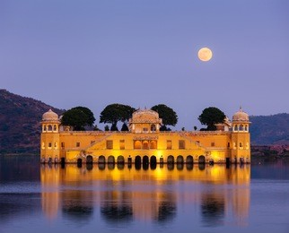 rajasthan landmark - jal mahal (water palace) on man sagar lake in the evening in twilight.  jaipur, rajasthan, india