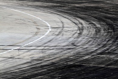 background with tire marks on road track