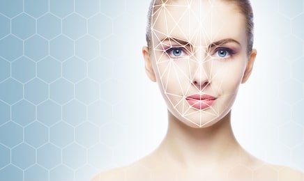 face of a beautifyl girl with a scanning grid on her face. face id, security, facial recognition, authentication technology.