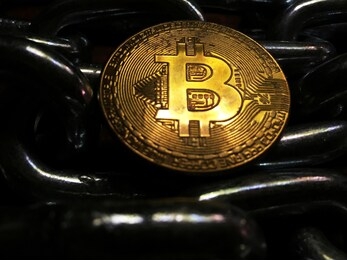 (btc)bitcoin. crypto currency gold bitcoin, btc, bit coin. macro shot of bitcoin coins isolated on black background blockchain technology, bitcoin gold concept