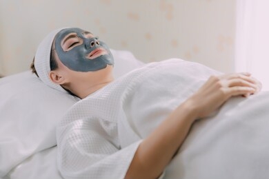 asian women in spa face peeling mask,skincare and getting facial care at spa salon,close-up