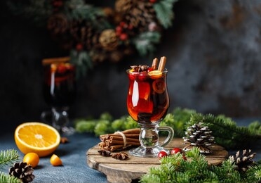 christmas mulled wine with spices, cranberry and orange. traditional christmas hot drink. christmas drink background