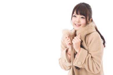 beautiful asian woman wearing coat on white background