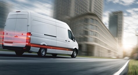 delivery van delivers fast in a city