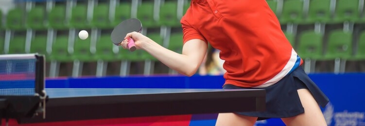 tennis player hits a racket on a tennis ball