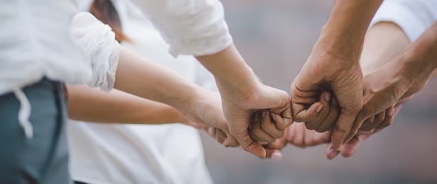 panoramic teamwork business join hand together concept, business team standing hands together, volunteer charity work. people joining for cooperation success business.