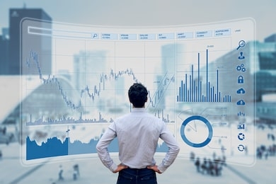 finance trade manager analysing stock market indicators for best investment strategy, financial data and charts with business buildings in background