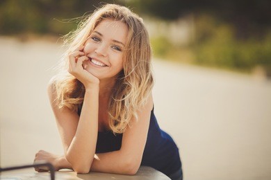 young smiling woman outdoors portrait. soft sunny colors.close portrait.