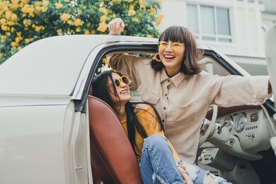 portrait of young asian woman friends smiling with happy on road trip.