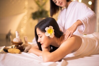 asian beautiful, young and healthy woman in spa salon. massage treatment spa room  . traditional medicine and healing concept.