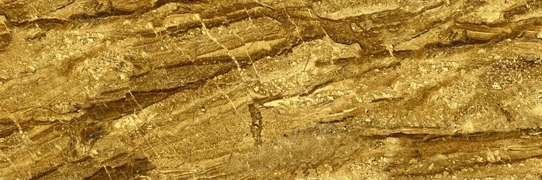 natural gold marble tiles for ceramic wall and floor, shiny yellow foil background, golden wall quartzite abstract, italian glittering stone wall texture, luxurious limestone emperador modern exterior