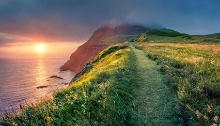amazing summer scene from sunset viewpoint in gasadalur village. fantastic evening landscape of vagar island. fantastic seascape of atlantic ocean, faroe islands, denmark, europe.