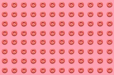 doughnut pattern. thel pattern of pink doughnuts lay flat on a pink background.